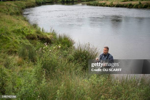 Man conducts a fly fishing demonstration at the Chatsworth Country Fair in the grounds of Chatsworth House, near Bakewell in northern England on...