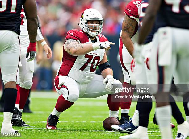 Evan Boehm of the Arizona Cardinals directs blockers during a preseason game against the Houston Texans at NRG Stadium on August 28, 2016 in Houston,...