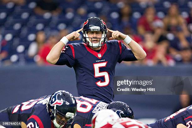 Brandon Weeden of the Houston Texans signals at the line of scrimmage during a preseason game against the Arizona Cardinals at NRG Stadium on August...