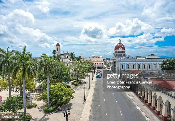 plaza de armas, town hall and cathedral with dramatic sky, cienfuegos, cuba - plaza de armas stock pictures, royalty-free photos & images