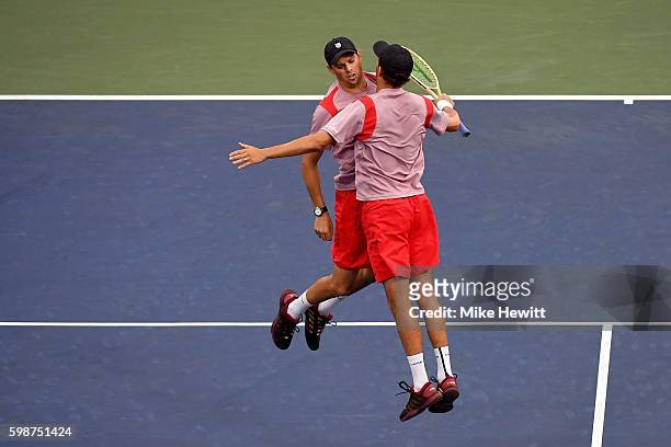 Bob Bryan and Mike Bryan of the United States celebrate their victory over Jonathan Erlich of Israel and Sam Groth of Australia Santiago Gonzalez of...