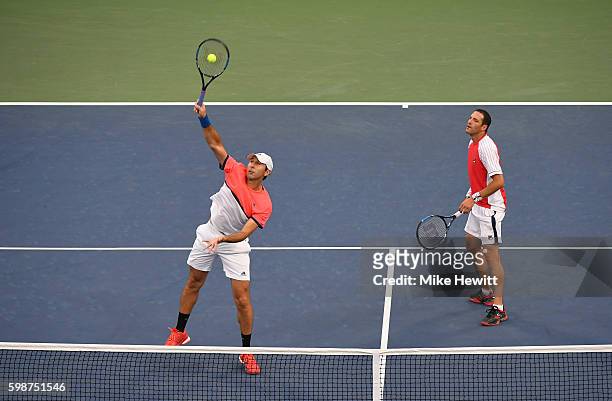 Santiago Gonzalez of Mexico and Jonathan Erlich of Israel in action against Bob Bryan and Mike Bryan of the United States during their second round...