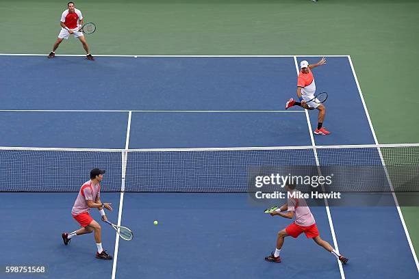 Bob Bryan and Mike Bryan of the United States in action against Jonathan Erlich of Israel and Santiago Gonzalez of Mexico during their second round...