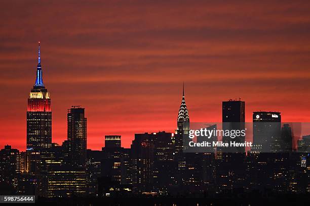 The sun sets behind the New York skyline on Day Five of the 2016 US Open at the USTA Billie Jean King National Tennis Center on September 2, 2016 in...