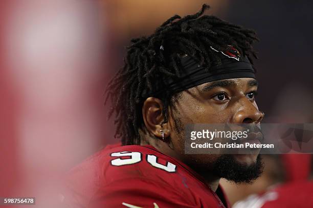 Defensive tackle Robert Nkemdiche of the Arizona Cardinals sits on the bench during the preseaon NFL game against the Denver Broncos at the...