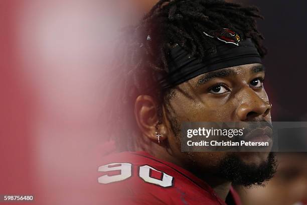 Defensive tackle Robert Nkemdiche of the Arizona Cardinals sits on the bench during the preseaon NFL game against the Denver Broncos at the...