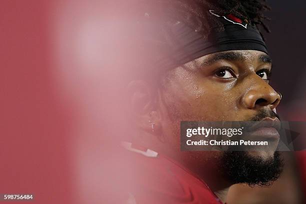 Defensive tackle Robert Nkemdiche of the Arizona Cardinals sits on the bench during the preseaon NFL game against the Denver Broncos at the...