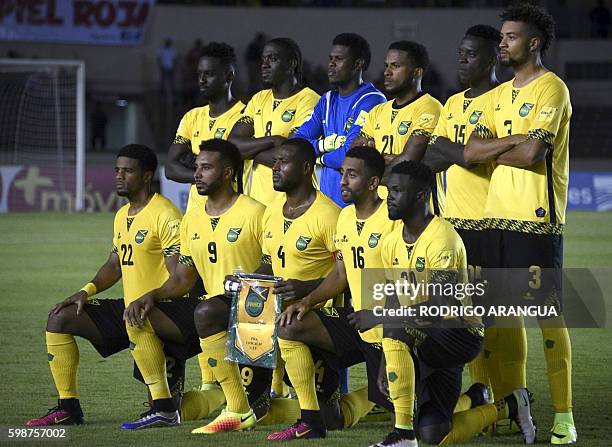 Jamaica players pose for pictures before the start of their FIFA World Cup 2018 qualifiers football match against Panama in Panama City on September...