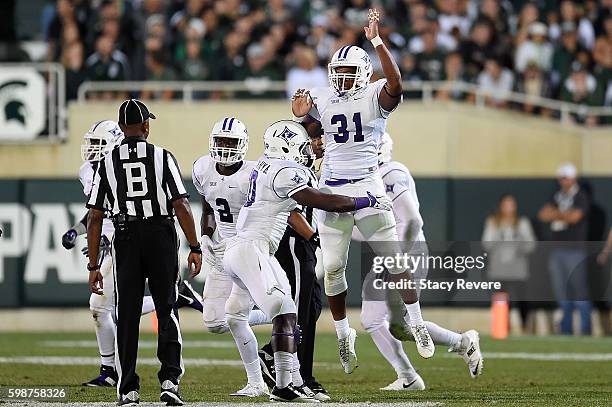 Byron Johnson of the Furman Paladins celebrates an interception during the second half of a game against the Michigan State Spartans at Spartan...