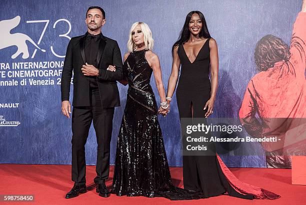 Riccardo Tisci, Donatella Versace and Naomi Campbell attend the premiere of FRANCA : Chaos and Creation during the 73rd Venice Film Festival on...