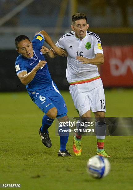 El Salvador's Guillermo Peraza and Mexico's Oscar Ceren vie for the ball during their Russia 2018 FIFA World Cup Concacaf Qualifiers football match,...