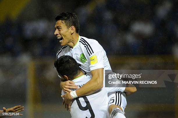 Mexico's Hector Moreno and Raul Jimenez celebrate after scoring against El Salvador during their Russia 2018 FIFA World Cup Concacaf Qualifiers...