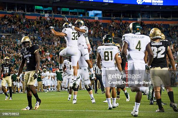 Tight end Nolan Peralta of the Colorado State Rams celebrates after scoring a second half touchdown against the Colorado Buffaloes at Sports...