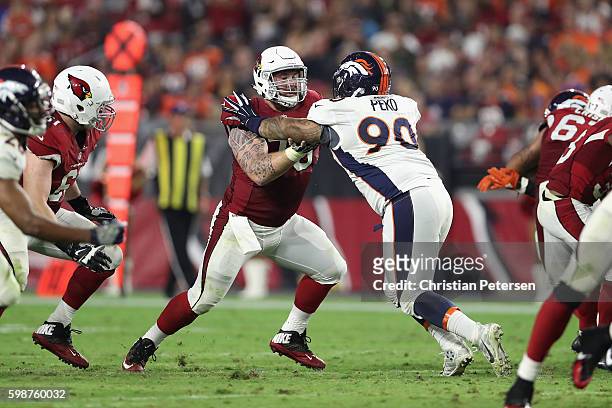 Center Evan Boehm of the Arizona Cardinals in action during the preseaon NFL game against the Denver Broncos at the University of Phoenix Stadium on...