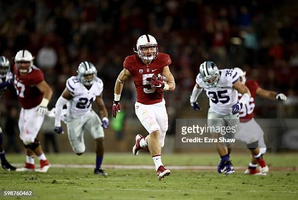 Christian McCaffrey of the Stanford Cardinal runs in for a touchdown against the Kansas State Wildcats at Stanford Stadium on September 2, 2016 in...