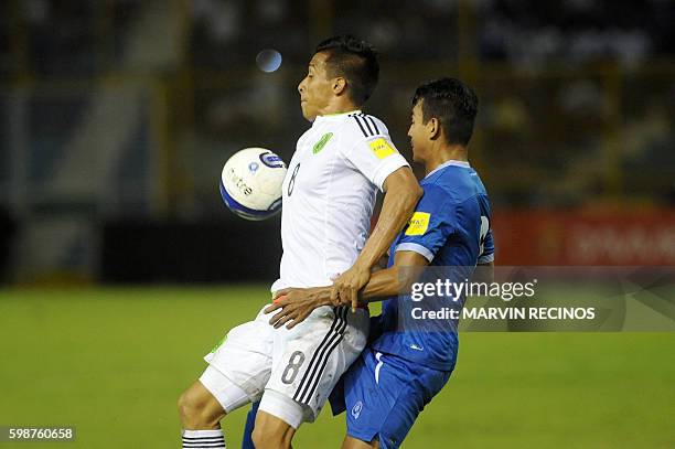 El Salvador's Xavier Garcia and Mexico's Angel Sepulveda vie for the ball during their Russia 2018 FIFA World Cup Concacaf Qualifiers football match,...