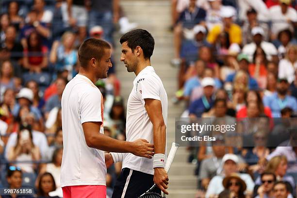 Mikhail Youzhny of Russia retires to Novak Djokovic of Serbia during his third round Men's Singles match on Day Five of the 2016 US Open at the USTA...