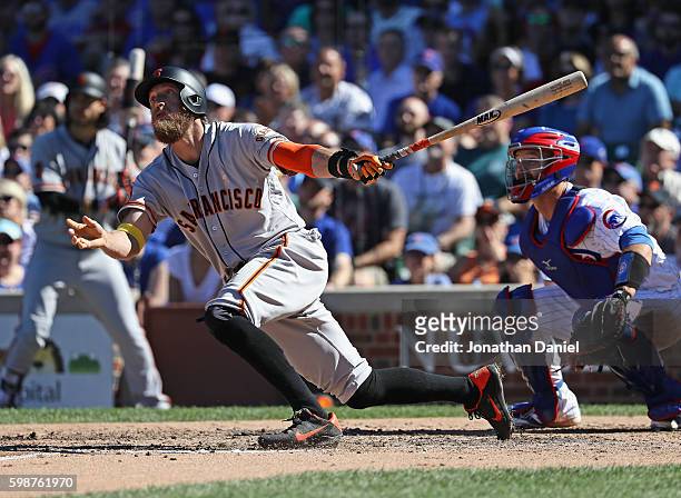 Hunter Pence of the San Francisco Giants breaks up a no-hit bid by Jon Lester of the Chicago Cubs with a solo home run in the 7th inning at Wrigley...