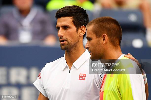 Mikhail Youzhny of Russia retires to Novak Djokovic of Serbia during his third round Men's Singles match on Day Five of the 2016 US Open at the USTA...