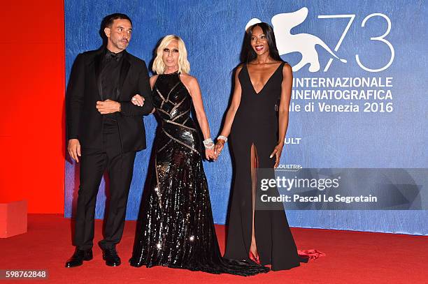 Riccardo Tisci, Donatella Versace and Naomi Campbell attend the premiere of 'Franca: Chaos And Creation' during the 73rd Venice Film Festival at Sala...