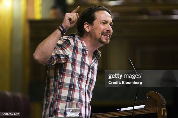 Pablo Iglesias, leader of Podemos, gestures while speaking at the parliament in Madrid, Spain, on Friday, Sept. 2, 2016. Acting Prime Minister...