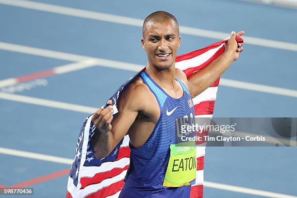 Day 13 Ashton Eaton of the United States celebrates after winning the gold medal in the Men's Decathlon event at the Olympic Stadium on August 18,...