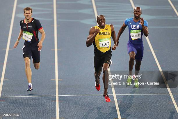 Day 13 Usain Bolt of Jamaica winning the gold medal in the Men's 200m Final with Christophe Lemaitre, , of France winning the bronze medal at the...