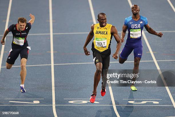 Day 13 Usain Bolt of Jamaica winning the gold medal in the Men's 200m Final with Christophe Lemaitre, , of France winning the bronze medal at the...