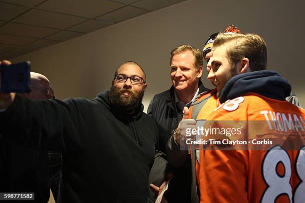 Commissioner Roger Goodell poses for a selfie with Denver Broncos fans before the Denver Broncos vs Pittsburgh Steelers, NFL Divisional Round match...