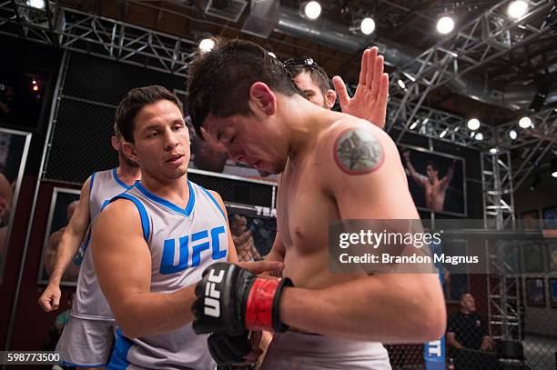Head coach Joseph Benavidez consoles Brandon Moreno after his submission loss to Alexandre Pantoja during the filming of The Ultimate Fighter: Team...