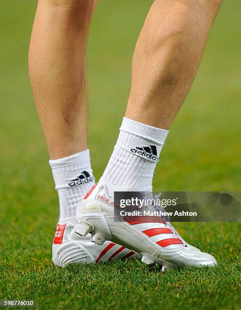 The Adidas football boots of David Beckham of AC Milan with the names of his three children - Brooklyn, Romeo and Cruz and a St Georges England flag...