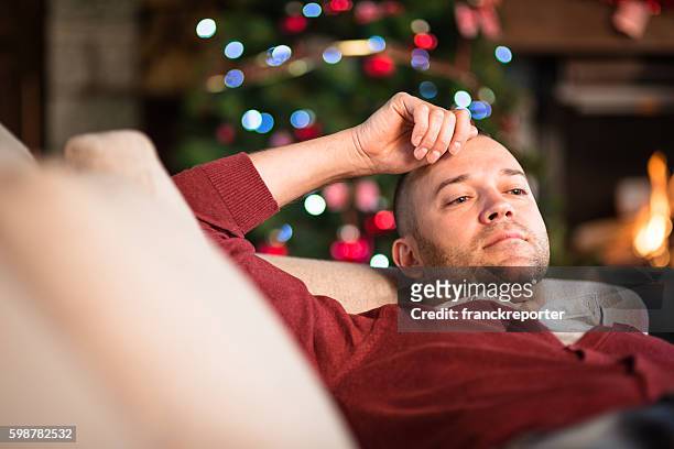 tired after the christmas party - holiday sadness stock pictures, royalty-free photos & images