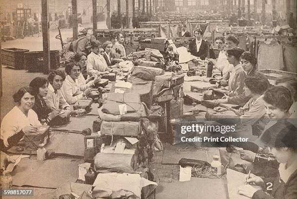 Nimble Assistants at the military post office in London, which dealt with the huge quantity of mail for the various battle fronts, circa 1916, ....