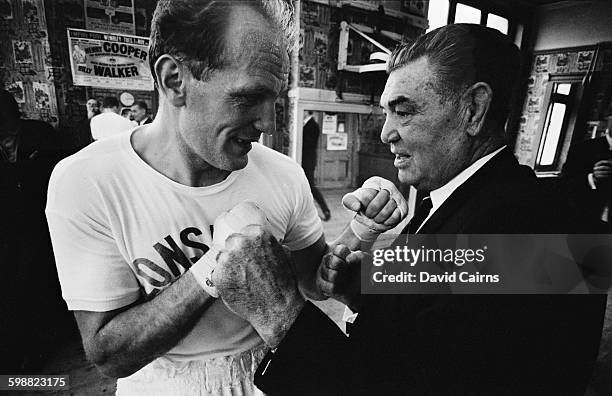 English heavyweight boxer Henry Cooper and American boxer Jack Dempsey , UK, 19th October 1967.