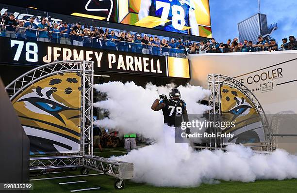 Jermey Parnell of the Jacksonville Jaguars runs onto the field before the preseason game against the Cincinnati Bengals at EverBank Field on August...