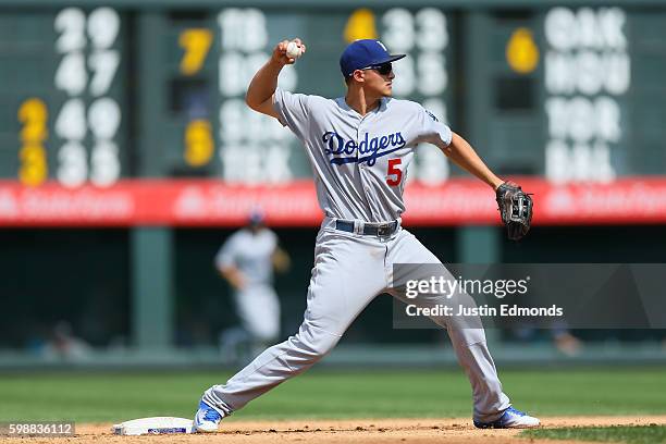 Corey Seager of the Los Angeles Dodgers makes a defensive play against the Colorado Rockies at Coors Field on August 31, 2016 in Denver, Colorado.