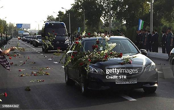 Motorcade follows the hearse believed to be carrying the body of Uzbek President Islam Karimov to the airport in Tashkent on September 3, 2016....