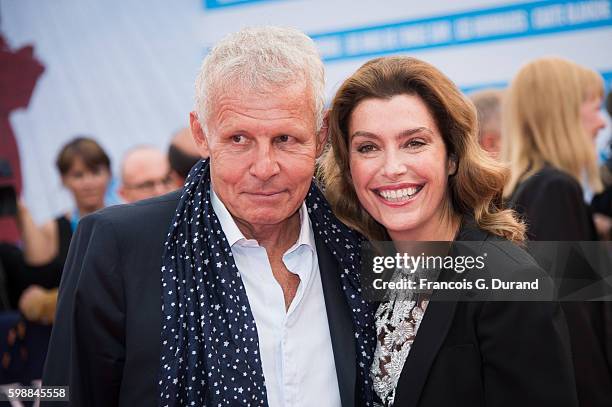 Daphne Roulier and Patrick Poivre d'Arvor arrives at the opening ceremony of the 42nd Deauville American Film Festival on September 2, 2016 in...