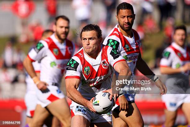 Mitch Rein of the Dragons offloads the ball during the round 26 NRL match between the St George Illawarra Dragons and the Newcastle Knights at WIN...