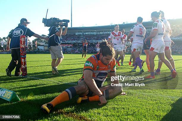 Jake Mamo of the Knights reacts after a Dragons try during the round 26 NRL match between the St George Illawarra Dragons and the Newcastle Knights...