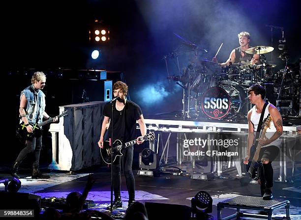 Musicians Michael Clifford, Luke Hemmings, Ashton Irwin and Calum Hood of 5 Seconds of Summer perform at Shoreline Amphitheatre on September 2, 2016...