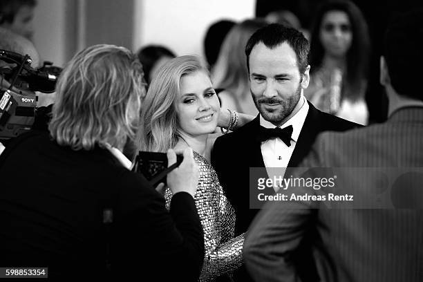 Amy Adams and Tom Ford attend the premiere of 'Nocturnal Animals' during the 73rd Venice Film Festival at Sala Grande on September 2, 2016 in Venice,...
