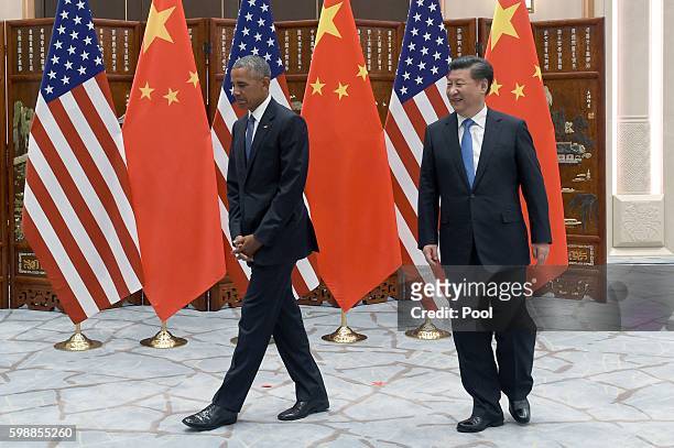Chinese President Xi Jinping meets with US President Barack Obama before their meeting at the West Lake State Guest House ahead of G20 Summit on...