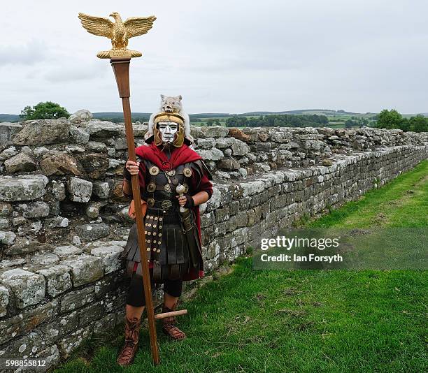 Roman soldier carrying the Eagle standard stands next to Hadrian's Wall as the lives of Roman Legionnaires are re-enacted during the Hadrian's Wall...
