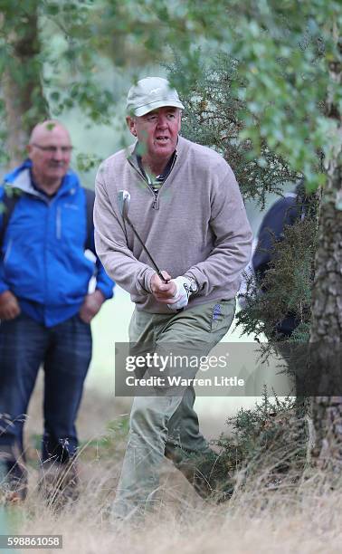 Greg Turner of New Zealand plays out of the trees on the 14th hole during the second round of the Travis Perkins Masters played on the Duke's Course...