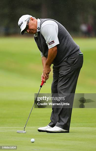Peter O'Malley of Asutralia putts on the fifth green during the second round of the Travis Perkins Masters played on the Duke's Course at Woburn Golf...