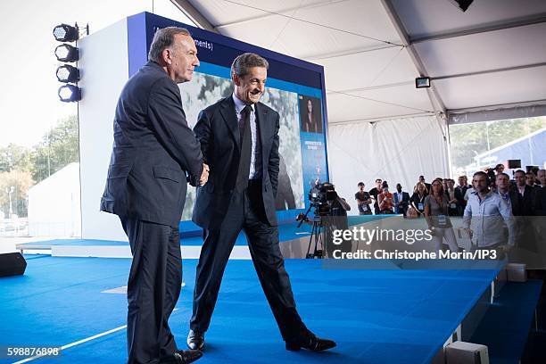 President of the French employers federation Medef, Pierre Gattaz hosts on stage Former French President and candidate for the Primary Election of...