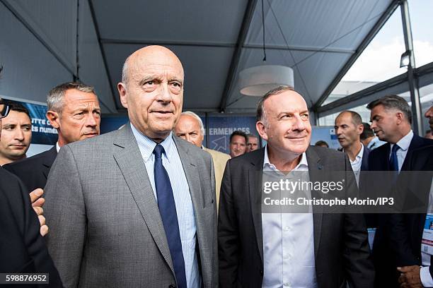 President of the French employers federation Medef, Pierre Gattaz and Mayor of Bordeaux and candidate for the Primary Election of the Right wing Les...