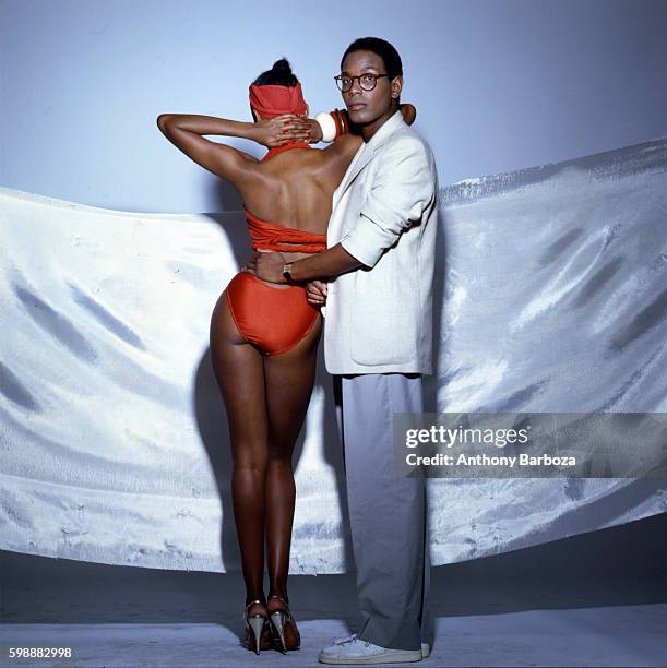 American fashion designer Willi Smith poses with his sister, fashion model Toukie Smith , New York, New York, 1980s.