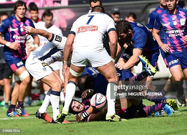 Stade Francais Paris' Australian lock Hugh Pyle vies with Clermont's players during the French Top 14 Rugby Union match between Stade Francais and...